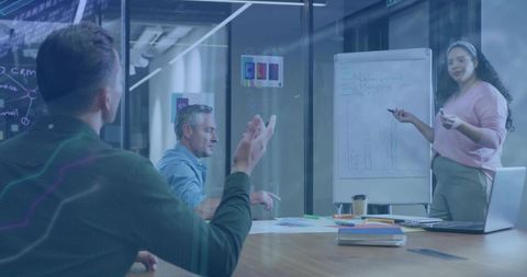 Businesswoman Leading Data Presentation in Modern Conference Room