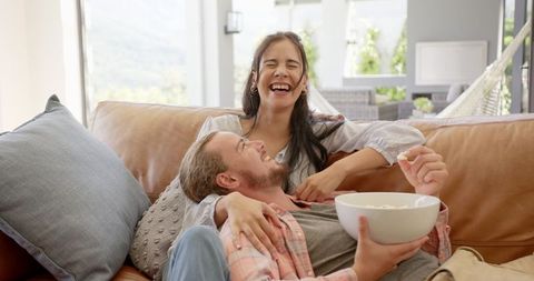 Happy Biracial Couple Enjoying Cozy Movie Time Together - Download Free Stock Images Pikwizard.com
