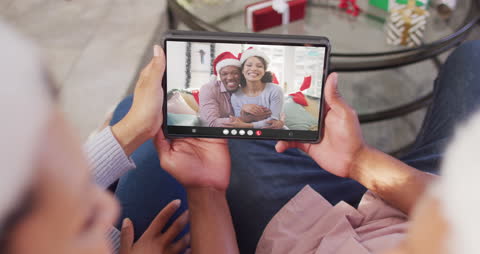 Festive Couple Video Calling During Christmas Celebrations