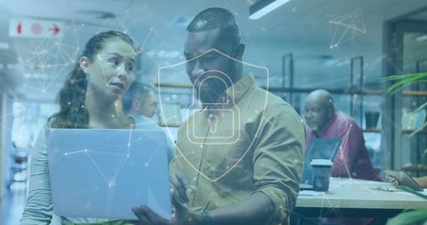 Diverse Team Discussing Digital Security in Modern Office