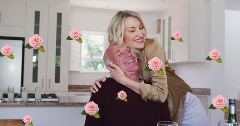 Senior Couple Enjoying Loving Embrace with Floral Overlay