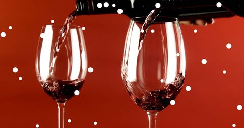 Festive Holiday Wine Pouring Experience with Falling Snow - Download Free Stock Images Pikwizard.com