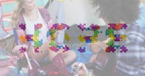 Camping friends playing guitar with colorful hope puzzle pieces overlay