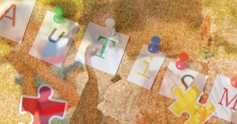 Autism awareness puzzle concept with colorful letters