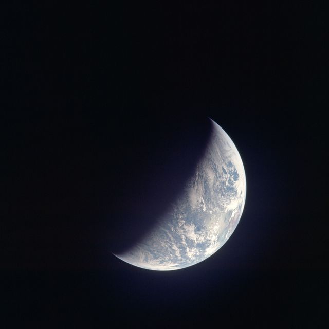 AS12-50-7362 (14 Nov. 1969) --- A view of one-third of Earth, with Australia on the horizon, as photographed by the three-man crew of Apollo 12. The Command and Service Modules, mated to the Lunar Module (yet to be removed and transpositioned for landing) were en route to the moon for man's second mission there. Onboard the spacecraft were astronauts Charles Conrad Jr., Richard F. Gordon Jr. and Alan L. Bean. Photo credit: NASA