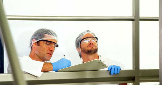 Inspecting Food Processing Facility with Safety Equipment - Download Free Stock Images Pikwizard.com