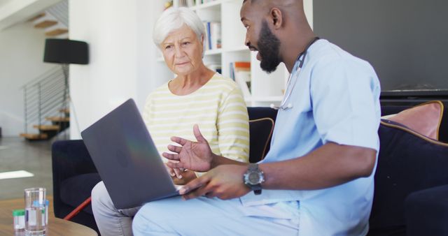 Senior Woman Consulting Doctor at Home with Laptop - Download Free Stock Images Pikwizard.com