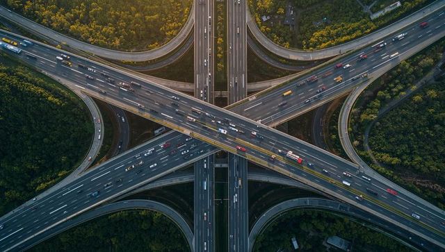 Carrying steady traffic over multi-level highway interchange at golden hour