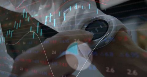 Professional woman using smartwatch with overlay market graphs