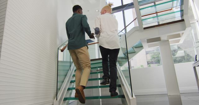 Diverse Businessmen Climbing Stairs in Modern Office Building - Download Free Stock Images Pikwizard.com