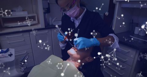 Female Dentist Performing Procedure with Futuristic Overlay