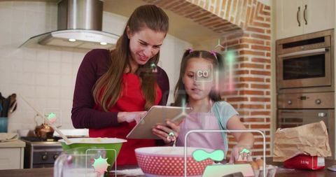 Mother guiding daughter through interactive baking with tablet and ar recipe guidance