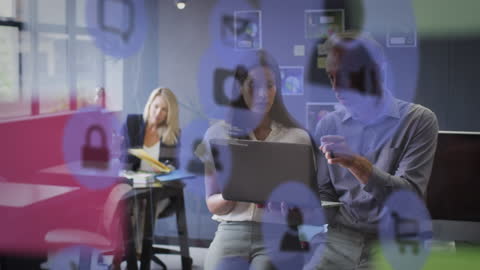 Diverse Coworkers Collaborating Over Digital Interface in Office