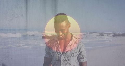 Man Enjoying Beach Sunset While Holding Smartphone