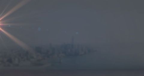 Light Trails with Blurry Cityscape in Background