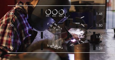 Welder leaning and welding with torch and hud overlay in industrial metal fabrication