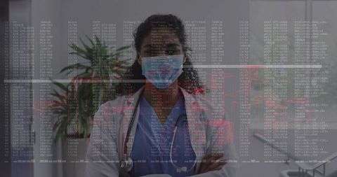Female clinician standing wearing mask and stethoscope with digital health data overlay