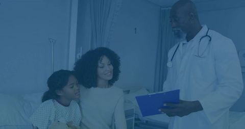 Doctor Consulting Mother and Daughter in Hospital Room