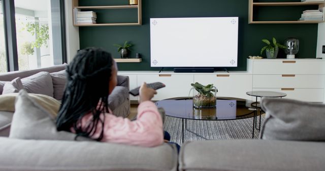 Person Relaxing on Sofa Watching TV - Download Free Stock Images Pikwizard.com