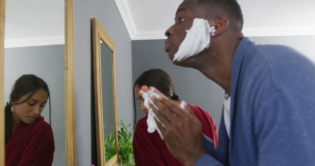 Man Applying Shaving Cream in Bathroom Mirror, Morning Routine - Download Free Stock Images Pikwizard.com