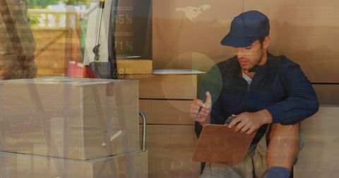Delivery man reviewing orders with digital overlay