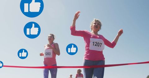 Women runners at finish line with social media likes