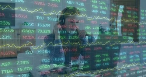 Businesswoman Analyzing Digital Stock Market Tickers in Modern Office