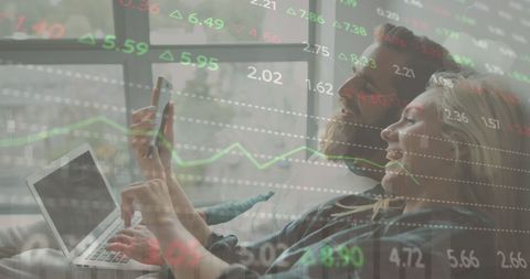 couple discussing investments with stock market overlay - Download Free Stock Images Pikwizard.com