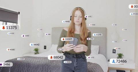 Content creator checking phone while live streaming with floating social media alerts