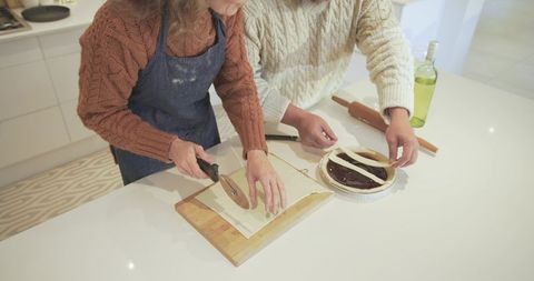 Couple preparing rustic lattice pie together at home