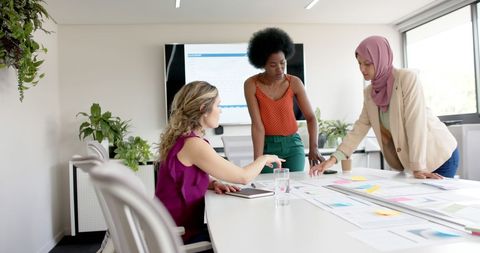 Diverse Women Collaborating in Office Meeting - Download Free Stock Images Pikwizard.com