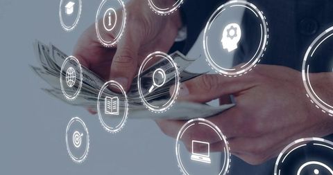 Executive counting cash while interacting with digital finance and technology icons overlay