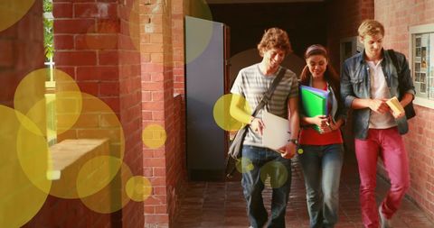 Teenagers Smiling While Walking in School Corridor