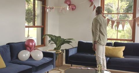 Cozy Living Room Decorated for Birthday Celebration with Balloons