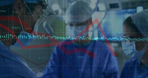 Surgical team in operating room reviewing digital data