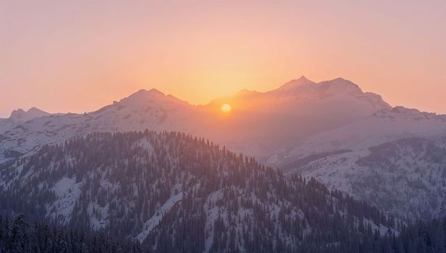 Pink Alpenglow Sunrise Bathing Snowy Alpine Peaks and Conifer Forest in Mist, Serene Dawn