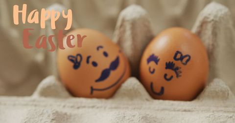 Cute easter eggs with faces in egg carton celebrating festive season