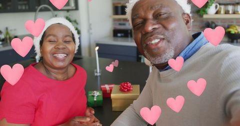 Happy Senior Couple Celebrating Love at Christmas