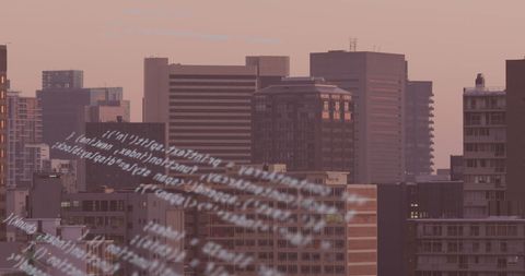 Digital Codes Overlaying Modern Cityscape at Dusk - Download Free Stock Images Pikwizard.com