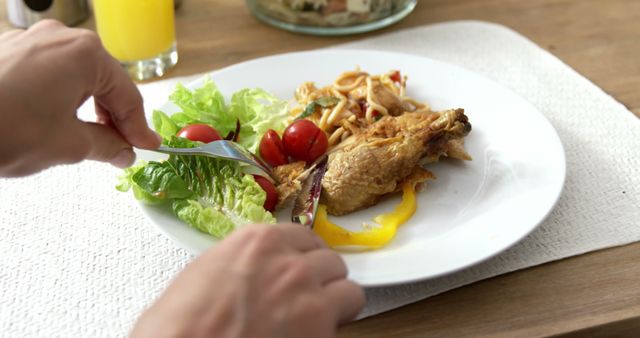 Person Enjoying Healthy Meal with Salad and Chicken - Download Free Stock Images Pikwizard.com