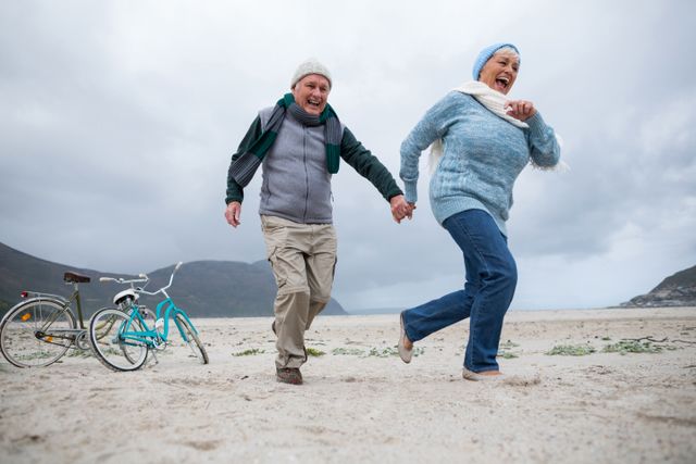 Happy Senior Couple Enjoying Beach Together - Download Free Stock Photos Pikwizard.com