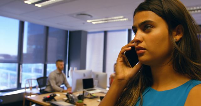 Young Businesswoman Having Phone Call in Modern Office - Download Free Stock Images Pikwizard.com