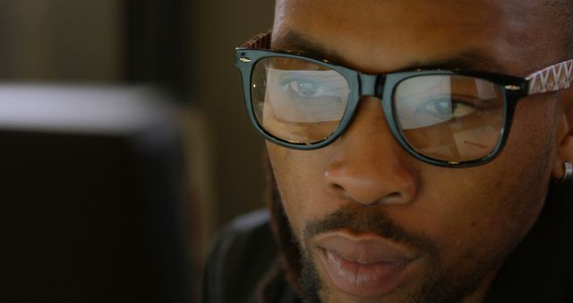 Focused African American Man Wearing Glasses Working on Computer - Download Free Stock Images Pikwizard.com