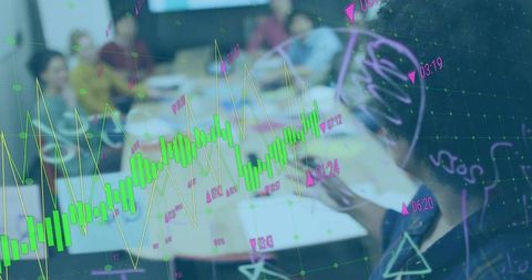 Financial analysts discussing stock trends with data projections