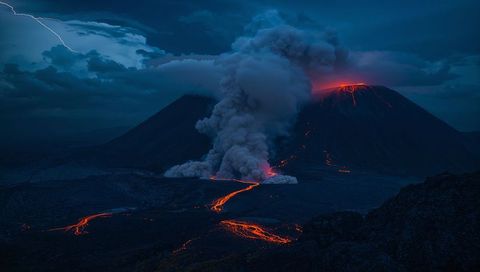 Dramatic Volcanic Eruption with Lightning and Lava Flows at Night