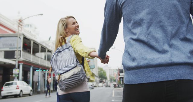 Joyful couple enjoys a daytime city stroll, hand in hand. - Download Free Stock Photos Pikwizard.com