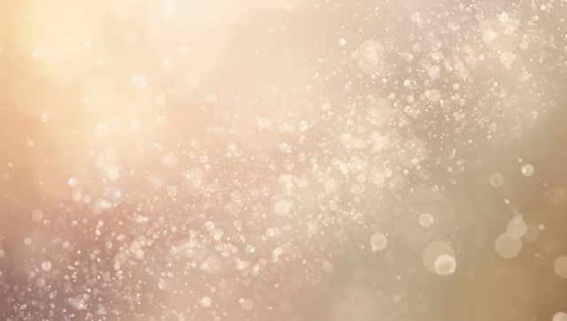Soft golden bokeh with drifting dust particles and warm beige glow for cinematic overlays