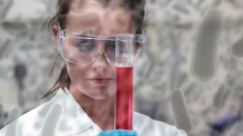 Scientific Researcher Analyzing Liquid Sample in Laboratory