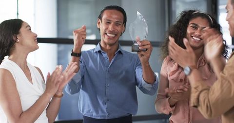 Diverse Team Celebrating Award Ceremony