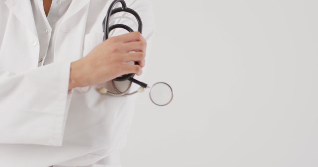 Doctor Holding Stethoscope in Professional Healthcare Setting - Download Free Stock Images Pikwizard.com